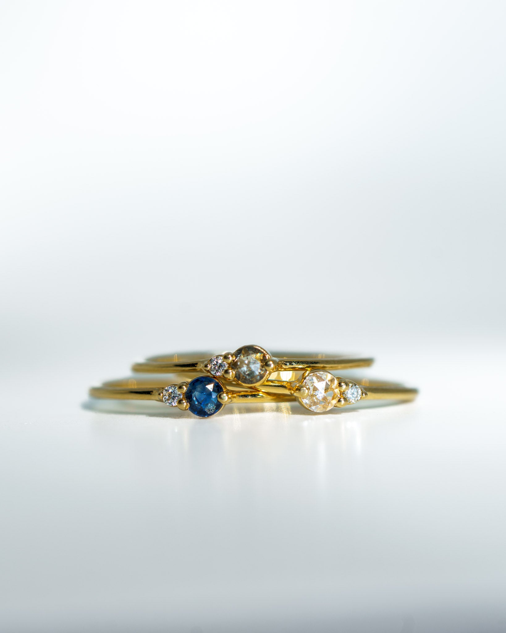 Arktos Ring with blue sapphire, white diamond & salt and pepper diamond