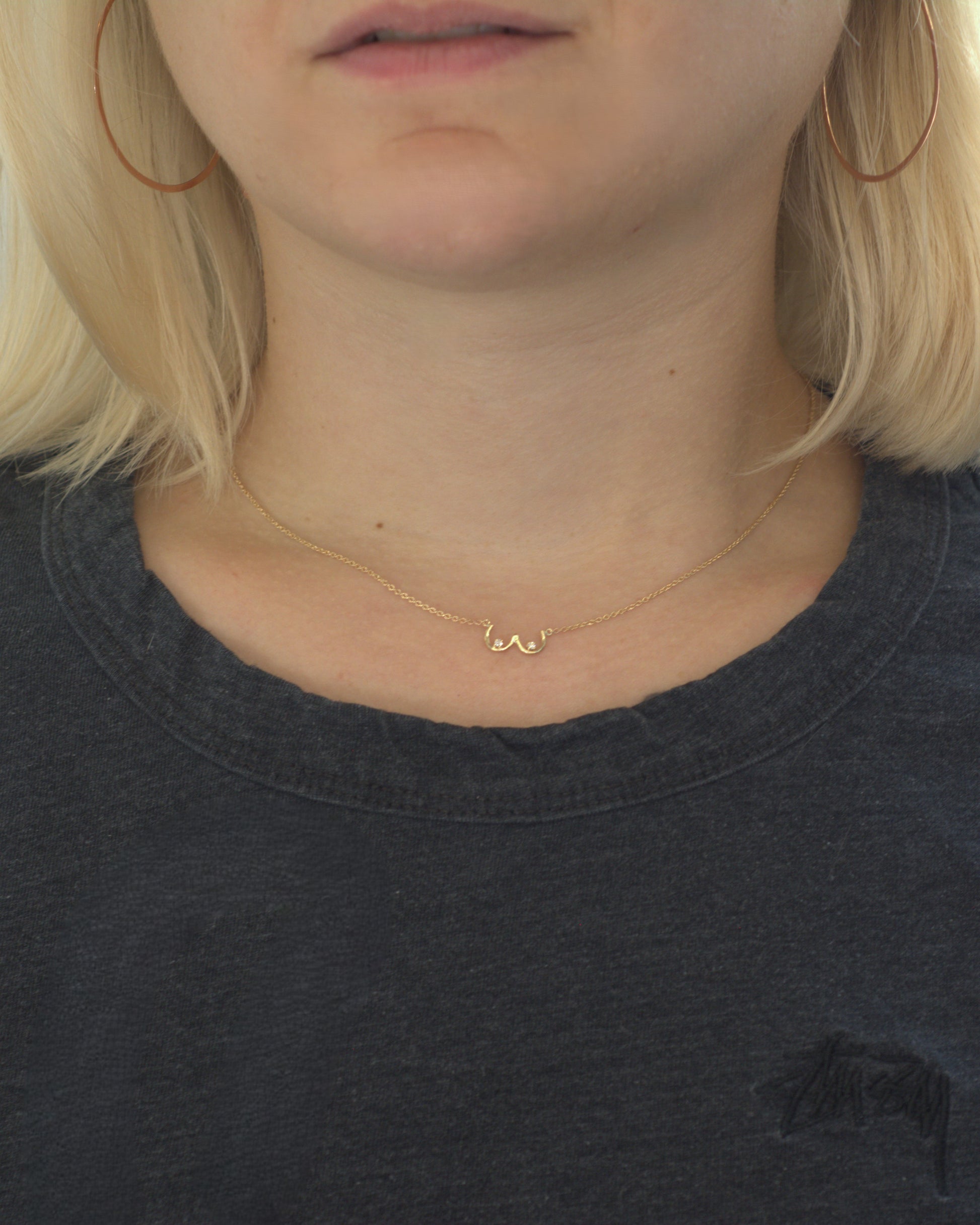 Boob Necklace modeled on a neck