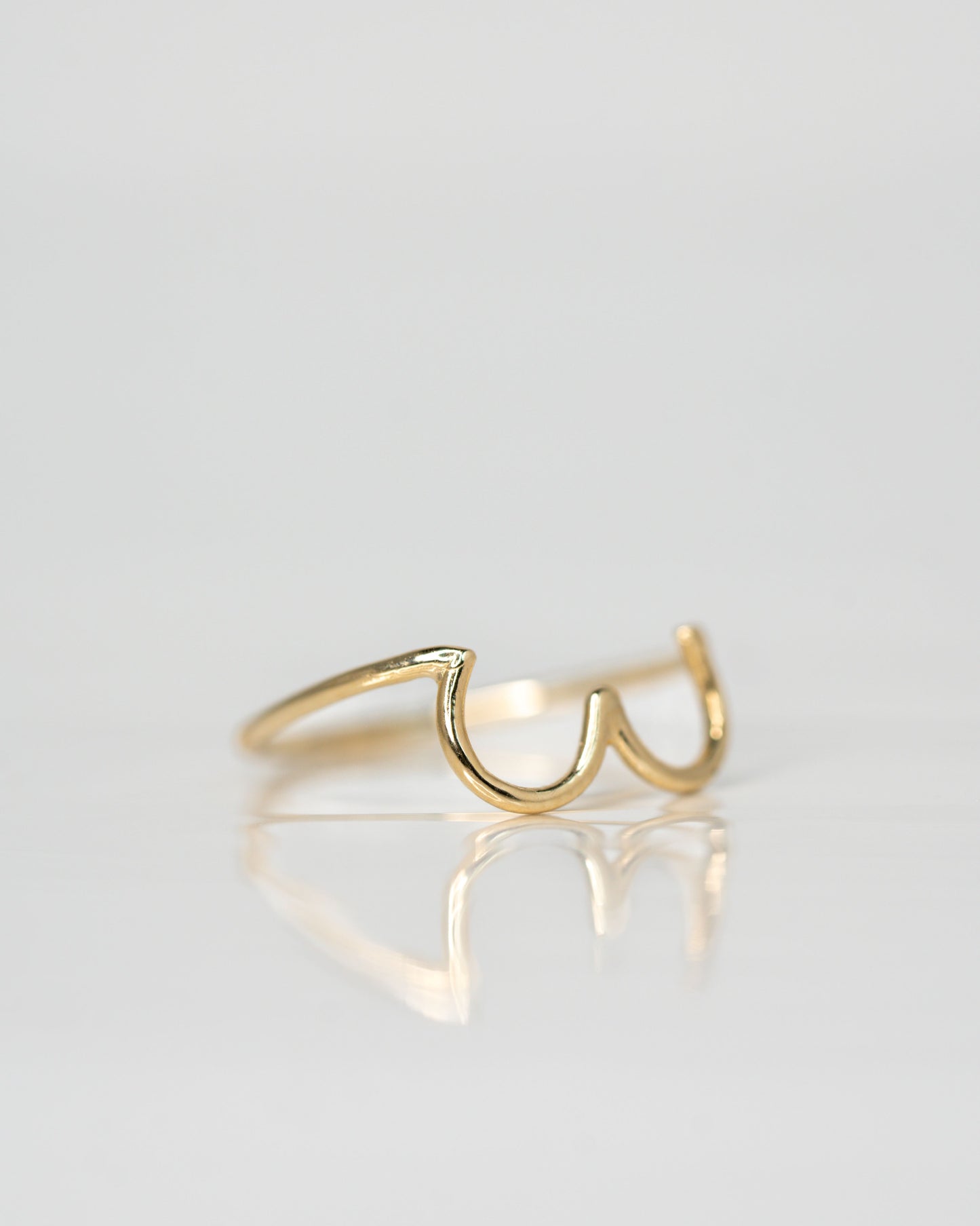 Side view of Boob Ring in 14k yellow gold