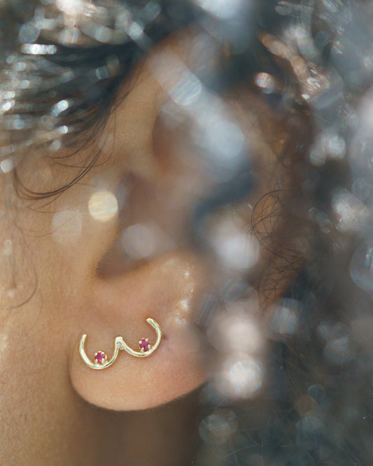 Boob Stud with rubies modeled on an ear