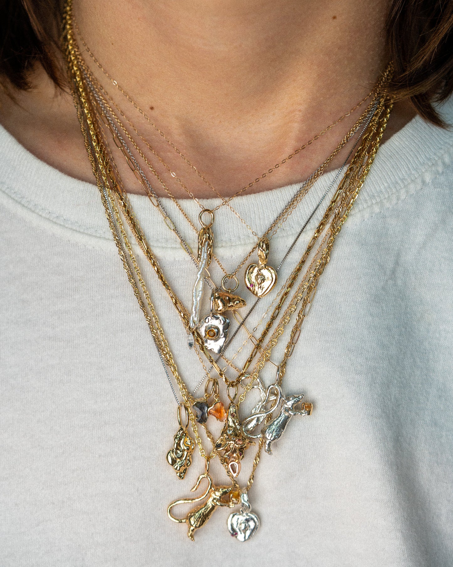 DMJ Charm Collection modeled on chains