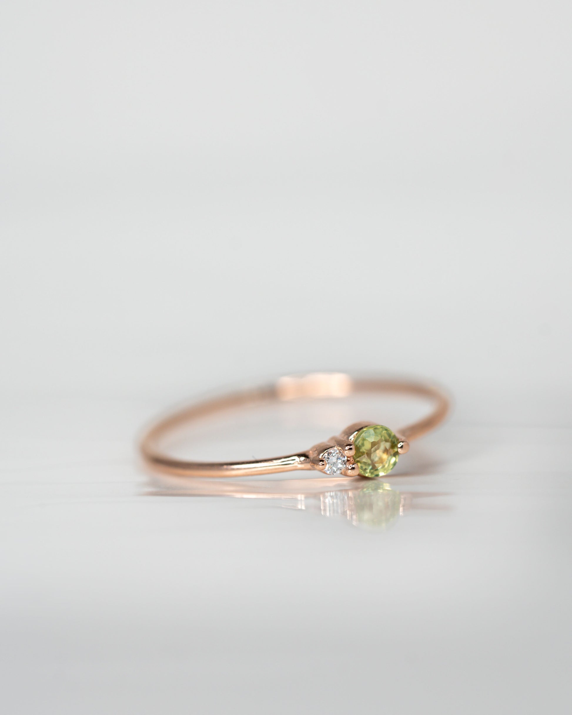 Side view of Green Sapphire Arktos Ring set in 14k rose gold