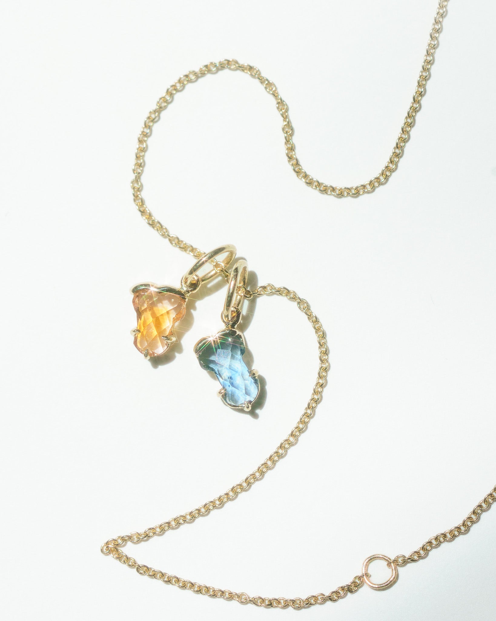 Hermes charms on a gold chain