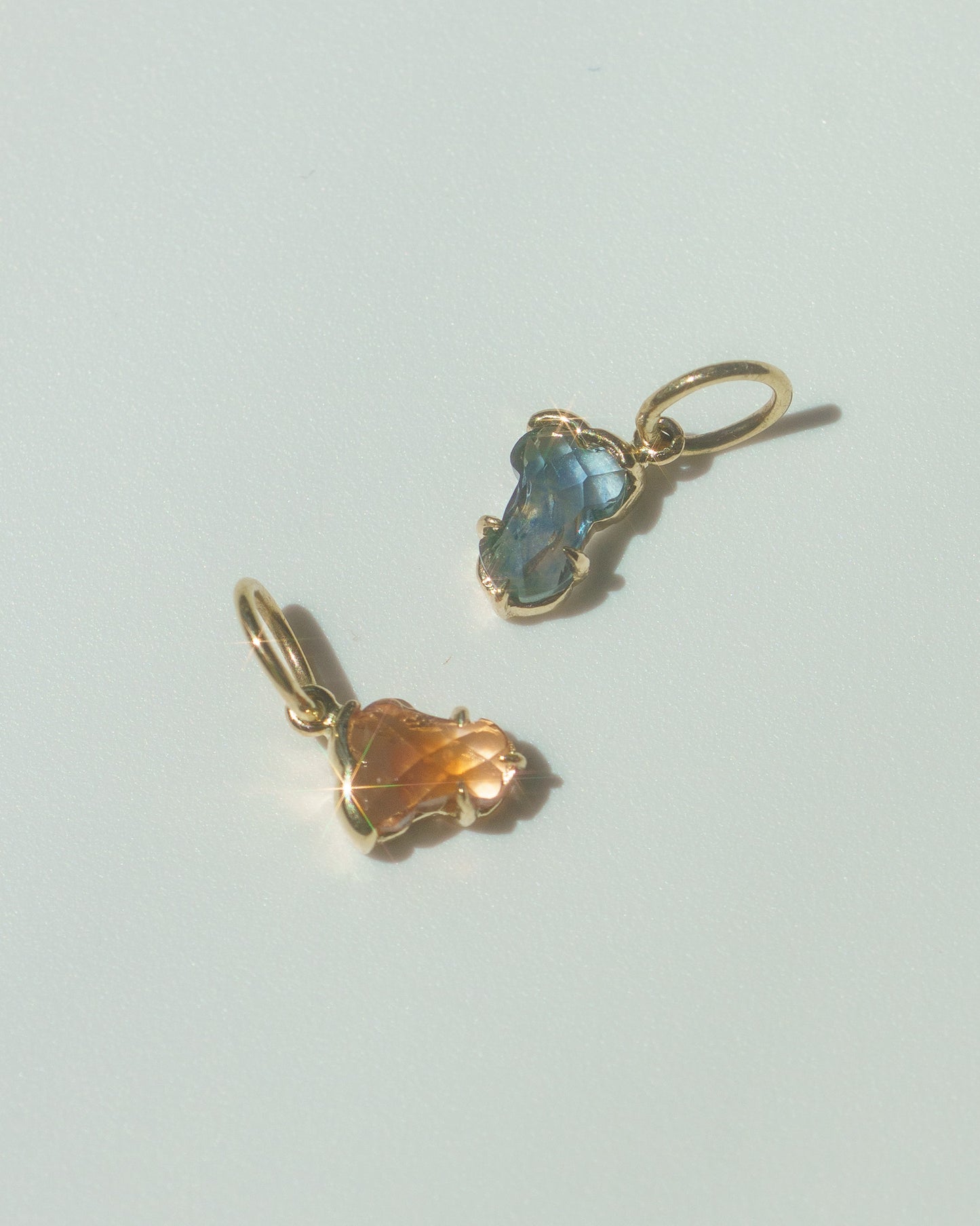 Blue and Orange sapphire Hermes charms