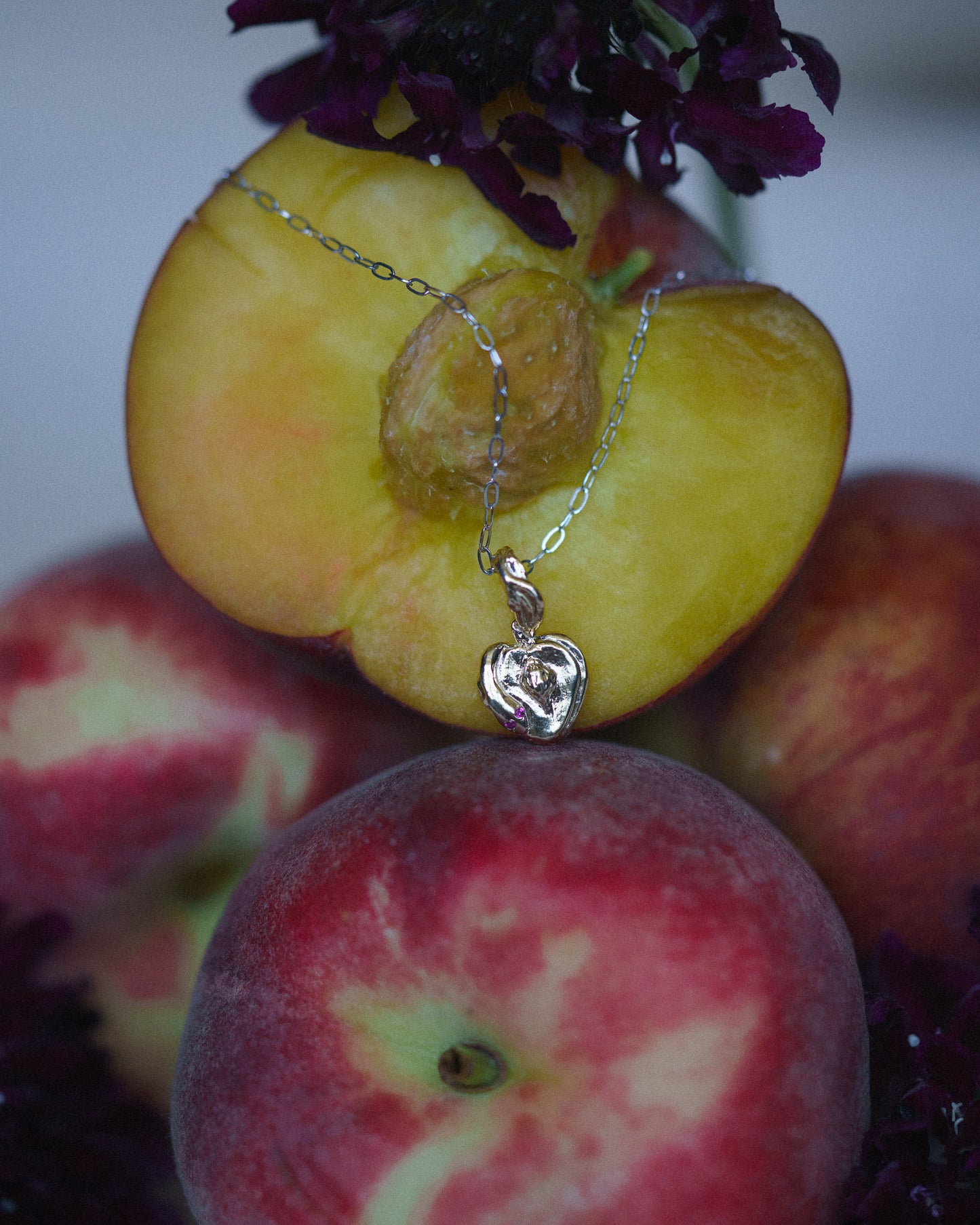 Lilith Charm on a chain with peaches