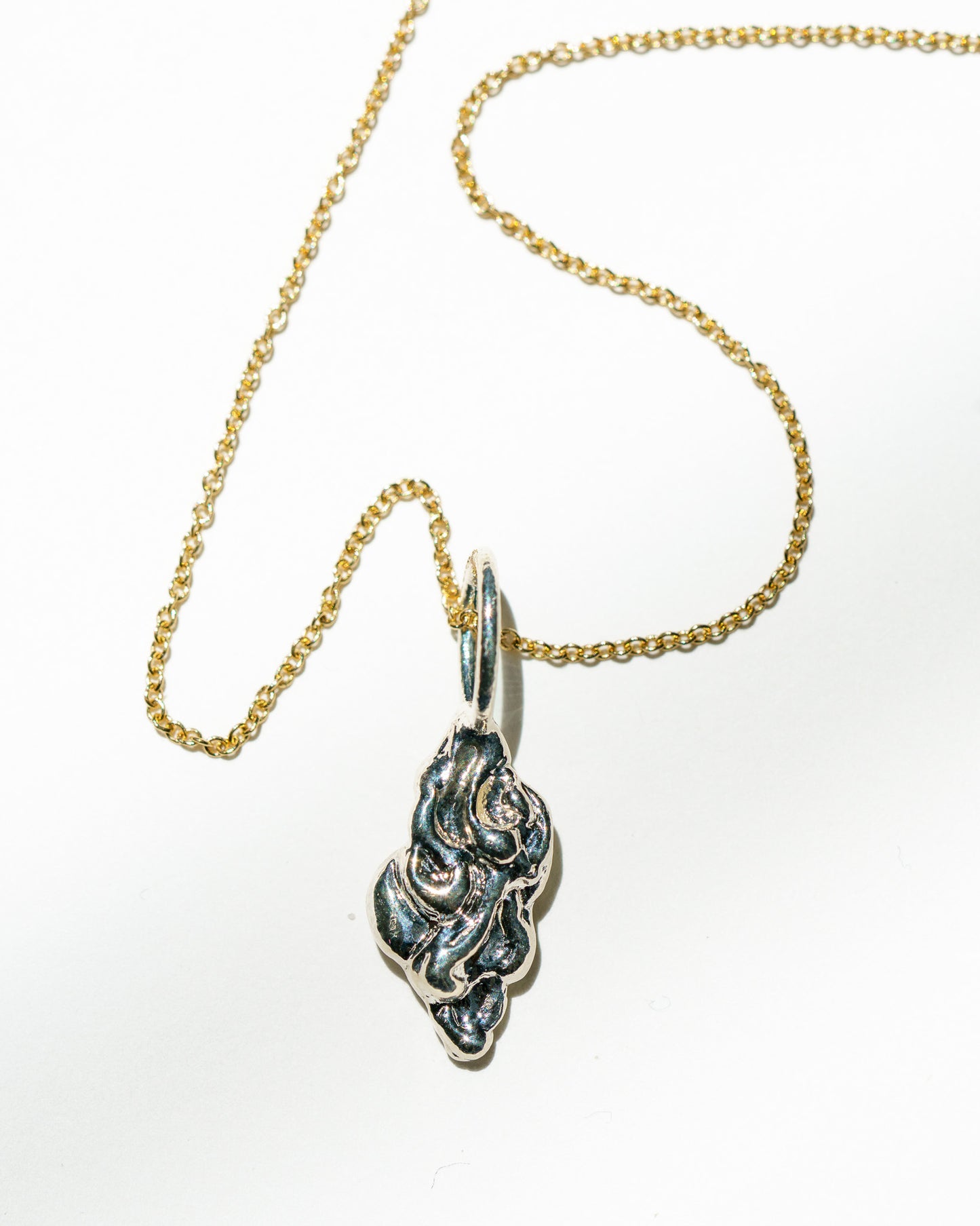 Moon & Stars Charm in sterling silver with white diamonds on a yellow gold chain
