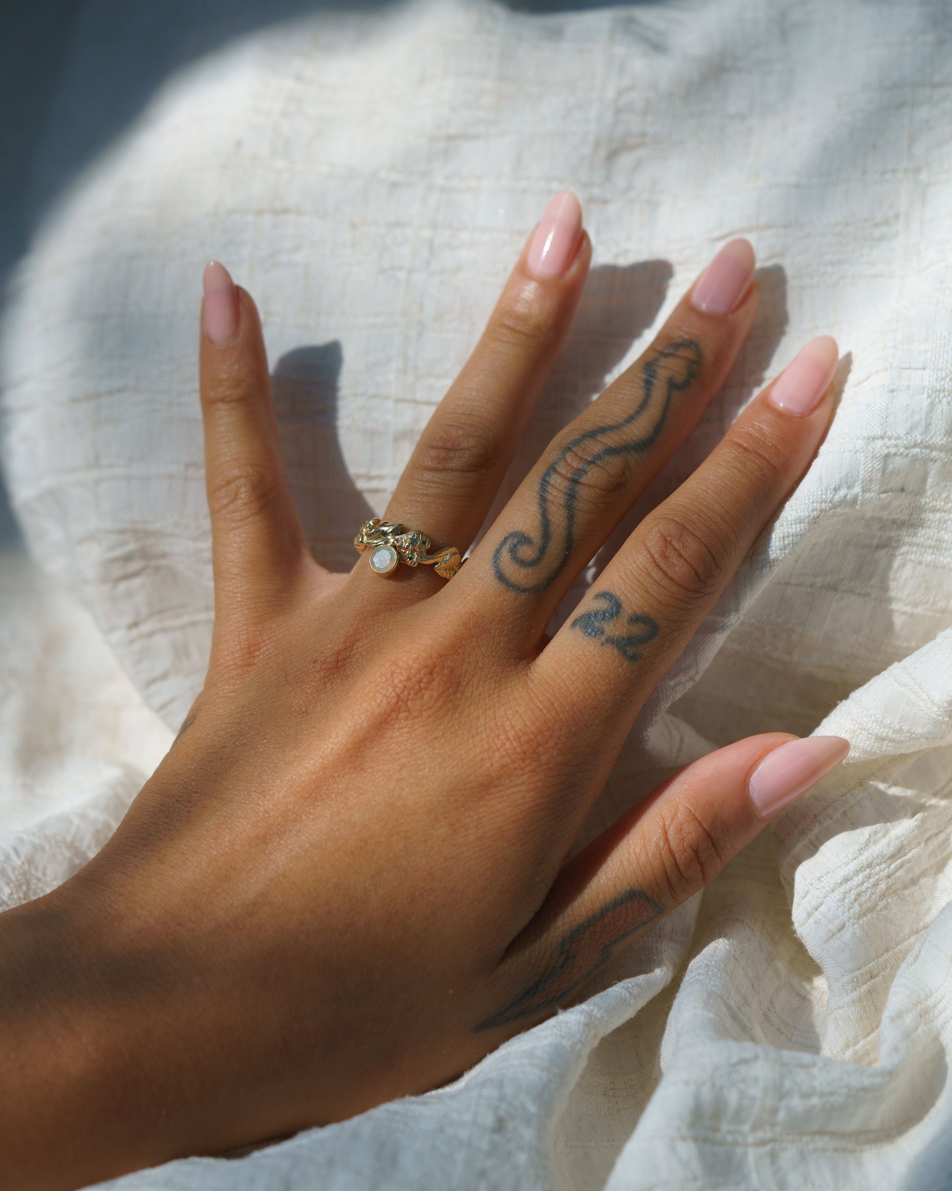 Opal Snake & Pothos Ring on a hand