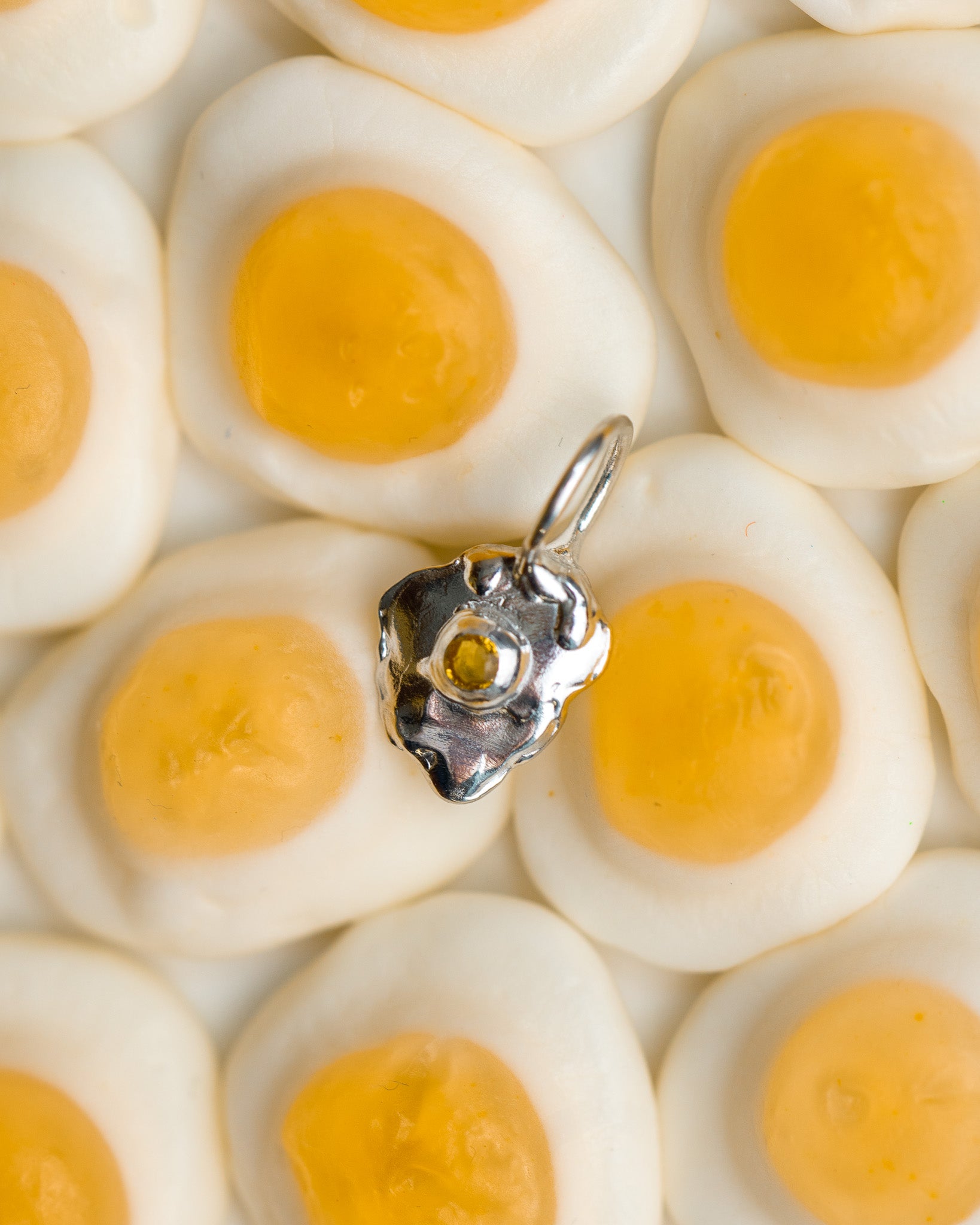 Sunnyside charm in sterling silver with a yellow sapphire yolk