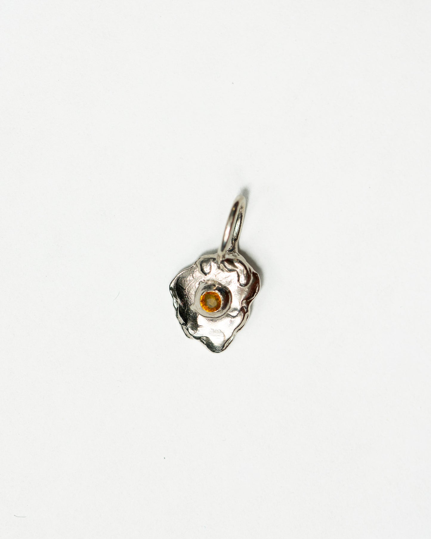 Sunnyside charm in sterling silver with a yellow sapphire yolk