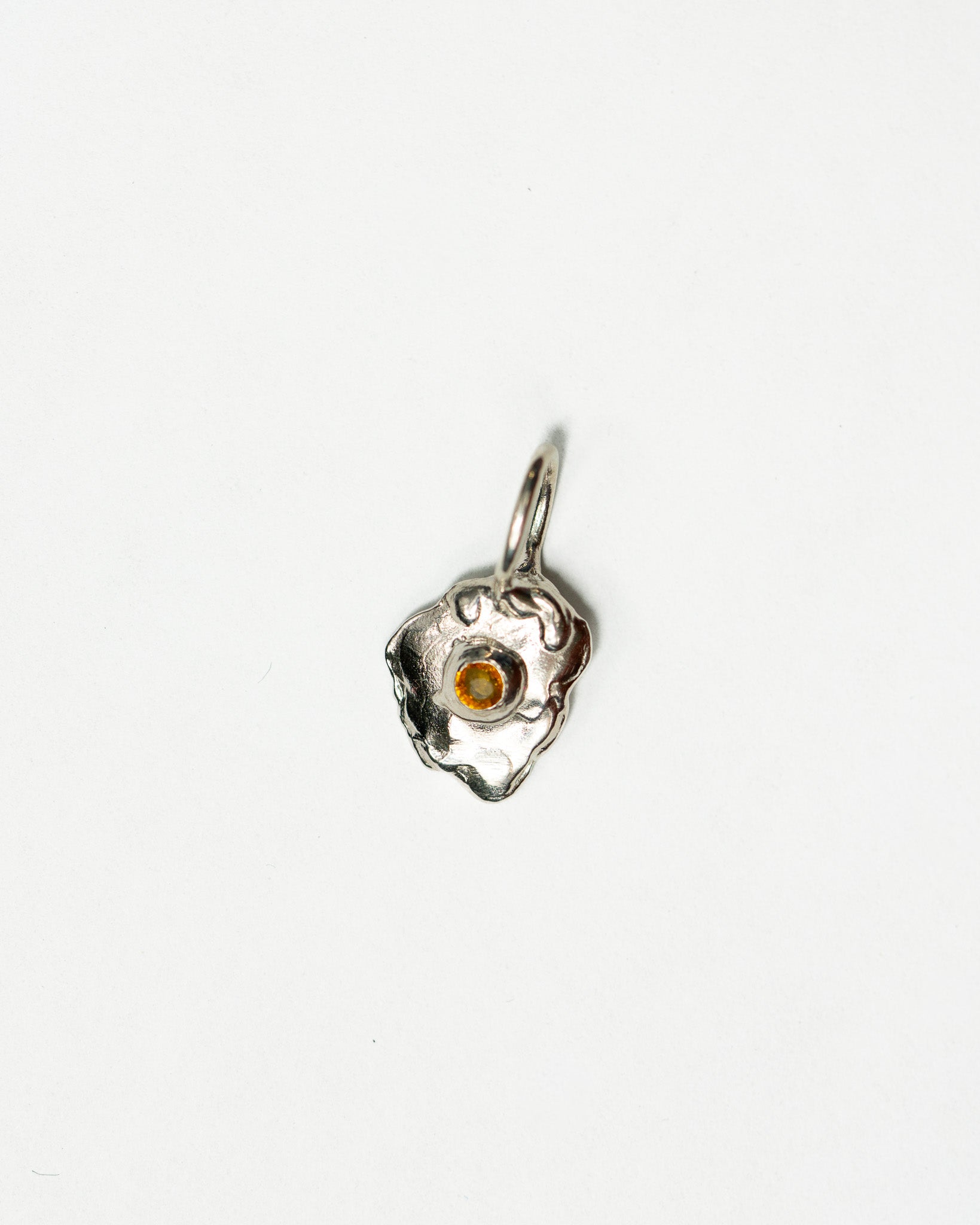 Sunnyside charm in sterling silver with a yellow sapphire yolk