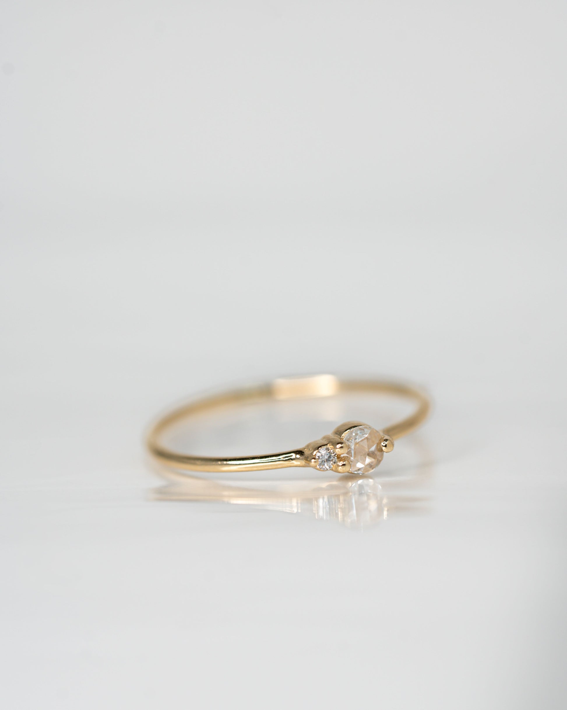 Side view of White Diamond Arktos Ring set in 14k yellow gold