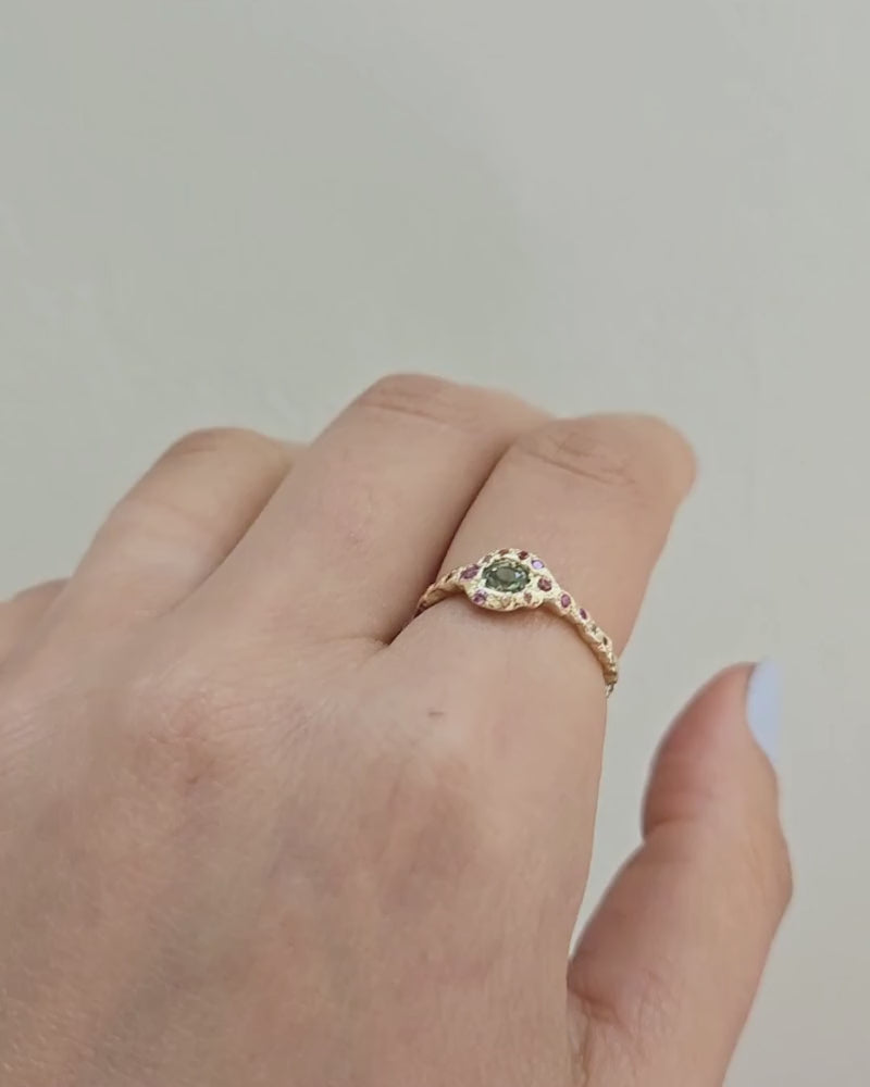 Video of Green Sapphire Fairy Ring in yellow gold modeled on a hand